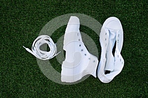 Pair of white unlaced sneakers