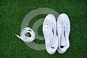 Pair of white unlaced sneakers