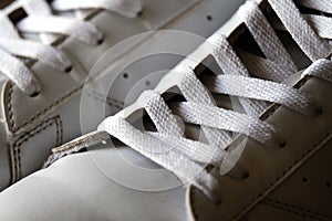 Pair of White Used Sneakers with shoelaces