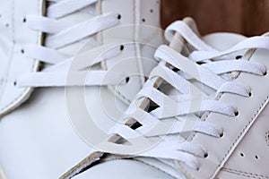 Pair of White Used Sneakers with shoelaces