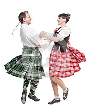 The pair woman and man dancing Scottish dance