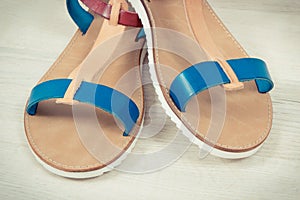 Pair of womanly leather sandals, shoes for using on holiday concept