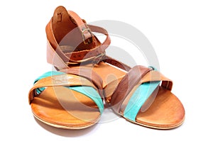 Pair of womanly sandals on white background