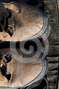 A pair of worn old brown leather boots