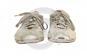 A pair of worn sneakers isolated on white
