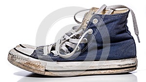 A pair of worn, vintage styled, classic sneakers on a white background