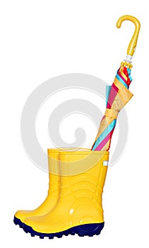 Pair of yellow rubber boots with colorful umbrella