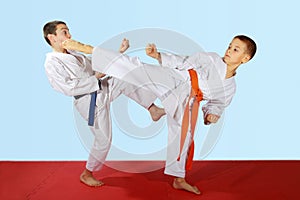 Paired exercises performed by athletes with blue and orange belt