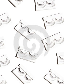 Pairs of black false eyelashes seamless pattern on the bright white background. Beauty concept