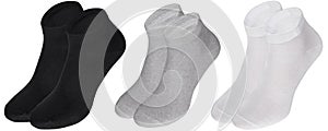 Pairs of black, grey and white socks isolated