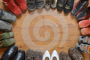 Pairs of different shoes standing in a circle photo