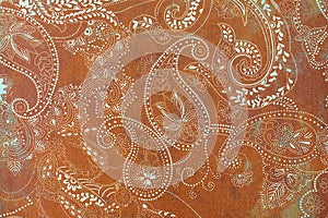 Paisley patterned background in shades brown and white.