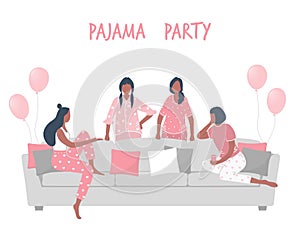 Pajama party. Slumber party. Young women in pajamas are sitting on the couch and talking. Some women are standing near the sofa