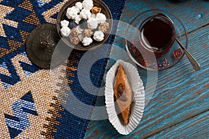 Pakhlava or baklava with glass of black tea