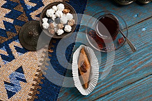 Pakhlava or baklava with glass of black tea