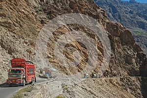 Pakistani decorated trucks travelling along the Karakoram highway. Pakistan. photo