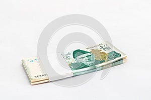 Pakistani five hundred rupees banknote bundle on white isolated background