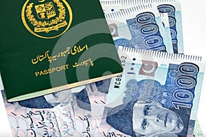 Pakistani passport on Pakistani rupee notes