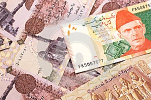 A Pakistani rupee bank note with Egyptian one pound bank notes