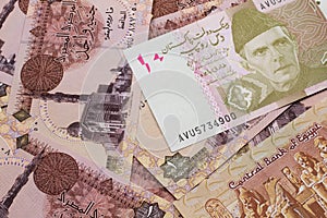 A Pakistani rupee bank note with Egyptian one pound bank notes