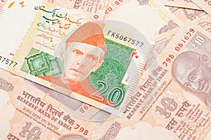 A Pakistani rupee bank note with Indian twenty rupee bank notes