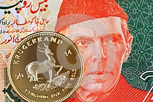 Pakistani twenty rupee bank note with a South African one ounce Krugerrand