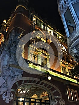 Palace of Catalan Music by night and sculptures photo