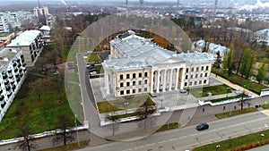 Palace of culture with beige facade and columns in old city