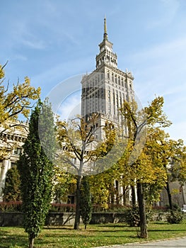 Palace of Culture and Science PKiN on a sunny autumn day in center of Warsaw, Poland. Clock tower of tallest building in Poland photo