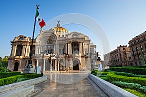 Palace of fine arts facade and Mexican flag