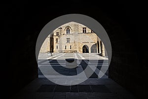 The Palace of the Grand Master of the Knights of Rhodes Greece Seen From Behind a Gothic Arch