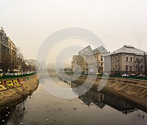 Palace of Justice building Palatul Justitiei early in the morning. View over Dambovita river in Bucharest, Romania, 2020