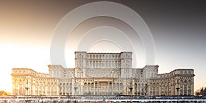 Palace of the Parliament building in Bucharest during an amazing winter sunset landscape landmark of Romania