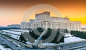 Palace of the Parliament building in Bucharest during an amazing winter sunset landscape landmark of Romania