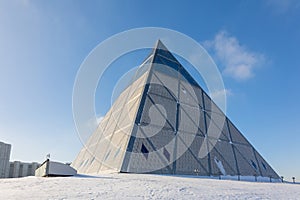 Palace of Peace and Accord. Modern architectural urbanistic city Astana. Futuristic building pyramids on sunny winter