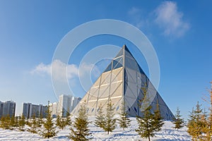 Palace of Peace and Accord. Modern architectural urbanistic city Astana. Futuristic building pyramids on sunny winter