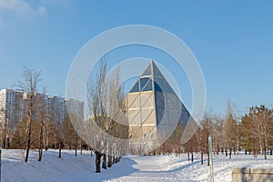 Palace of Peace and Accord. Modern architectural urbanistic city Astana. Futuristic building pyramids on sunny winter