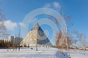 Palace of Peace and Accord. Modern architectural urbanistic city Astana. Futuristic building pyramids on sunny winter