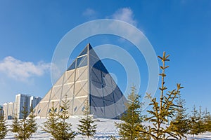 Palace of Peace and Accord. Modern architectural urbanistic city Astana. Futuristic building pyramids on sunny winter