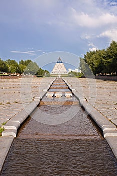 Palace of Peace and Accord - Pyramid (Astana, Kazakhstan) with water on front photo