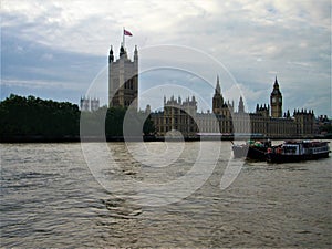 The Palace of Westminster, the River Thames, boats, water, tourism and history in London city, England