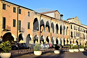 Palaces in Piazza del Santo in Padua, with the facades illuminated by the sun, close to sunset.