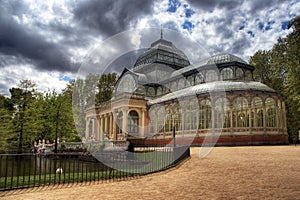 Palacio de cristal with dramatic clouds