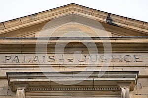 Palais de justice text on entrance ancient wall facade building means in french courthouse justice court