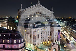 Palais Garnier opera house at night in Paris, France.