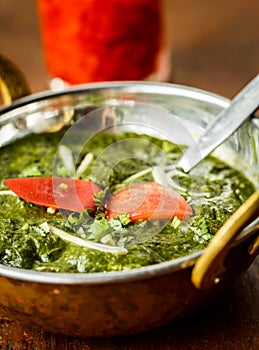 Palak paneer with tomatoes. Indian dishes