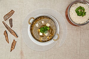 Palak panir or palak paneer with plain rice served in a dish isolated on table top view of indian spices food