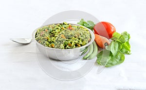 Palak or Spinach Rice Pilaf in a Steel Bowl photo