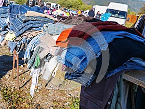 Used clothes for sale on local market.