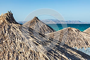 Palapas on a beach near La Paz